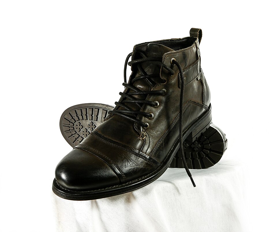 A pair of polished black leather boots